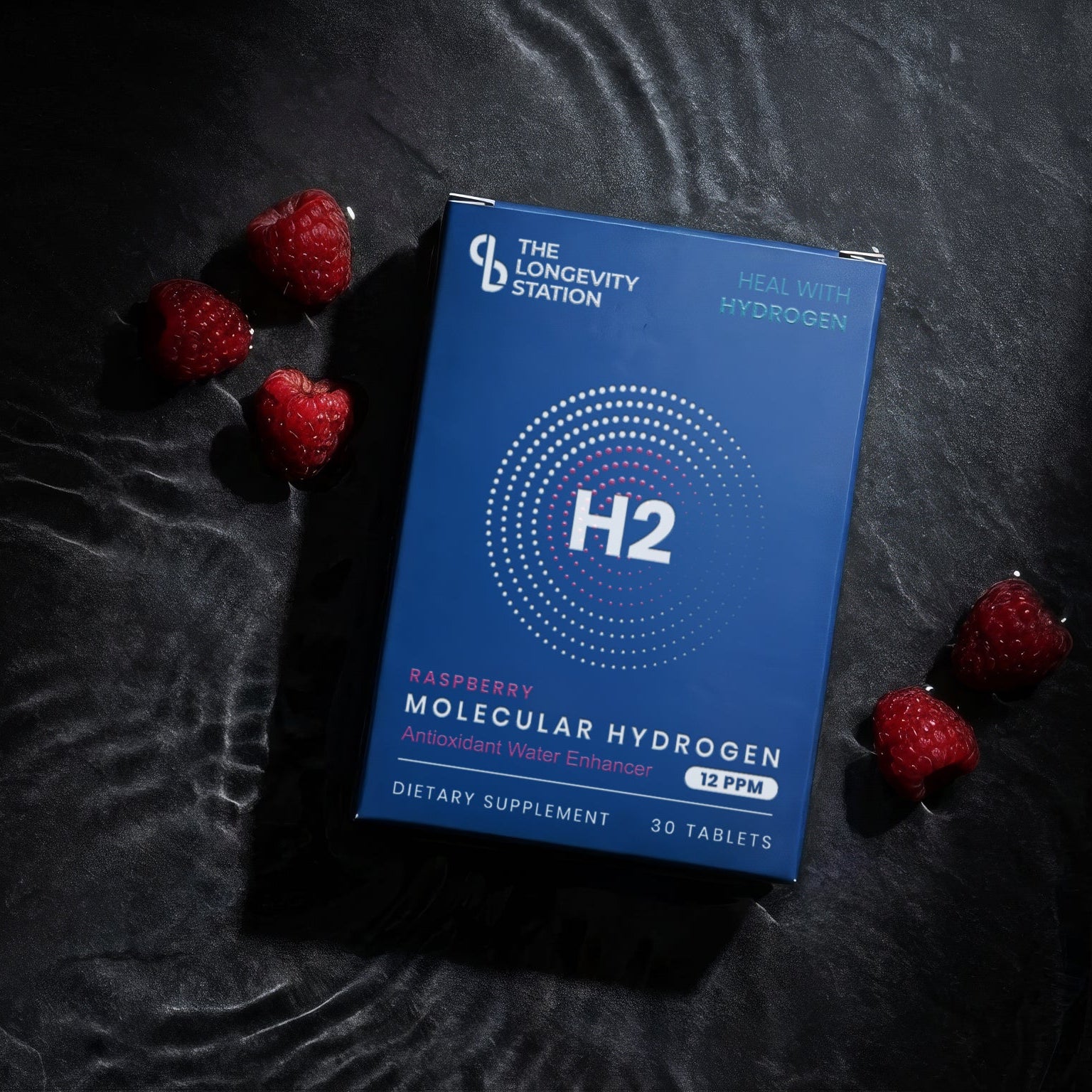 Blue packaging labeled 'H2' on a dark textured surface with red berries.